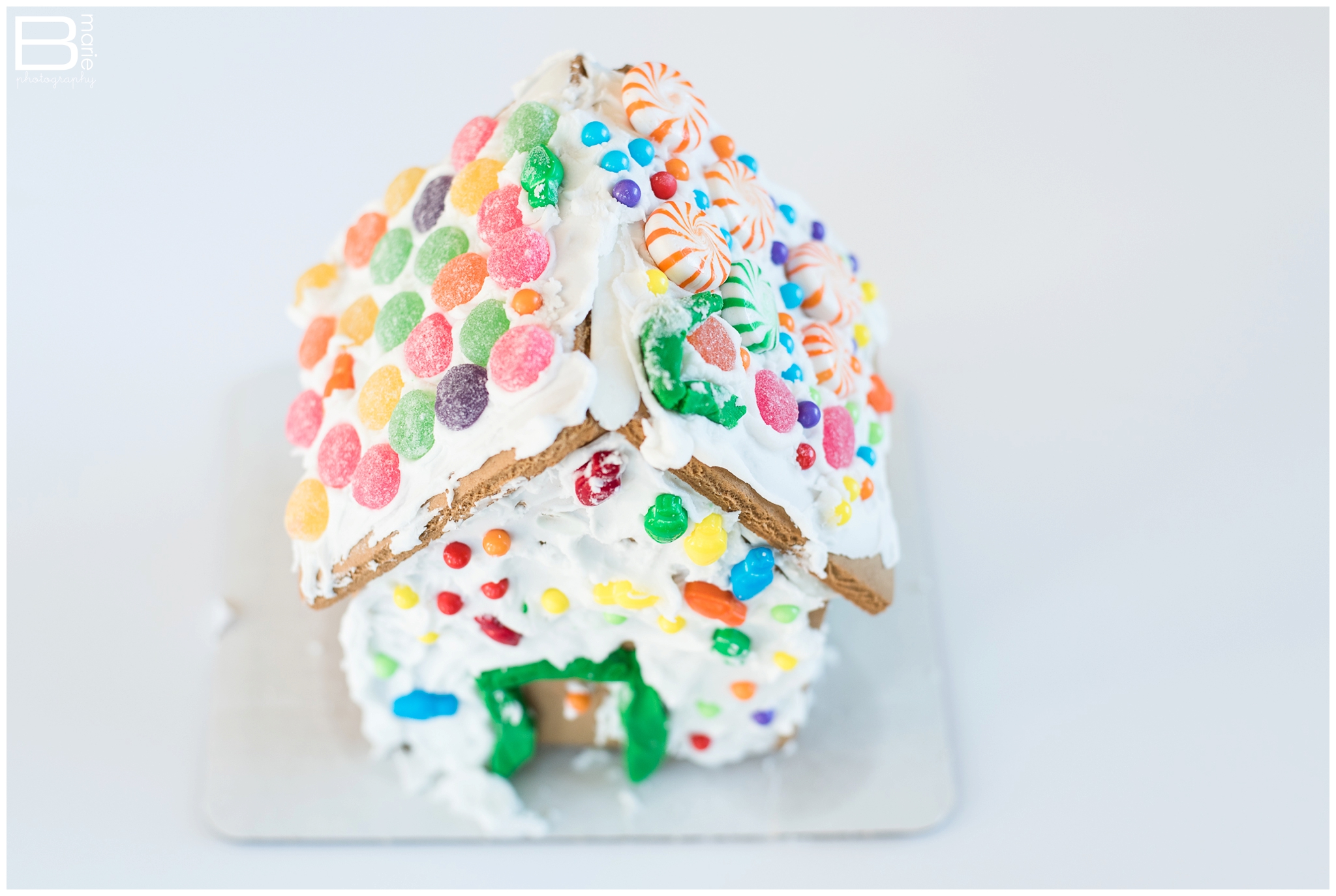 Kingwood family photographer image of gingerbread house decorated by daughter