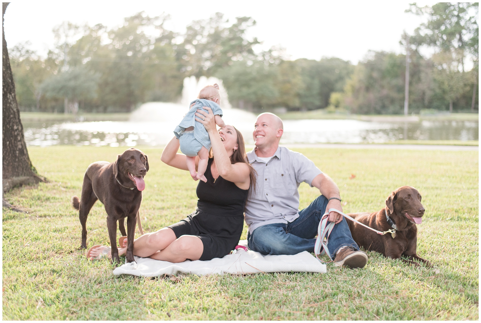 Kingwood photographer outdoor family portrait session with infant and two dogs