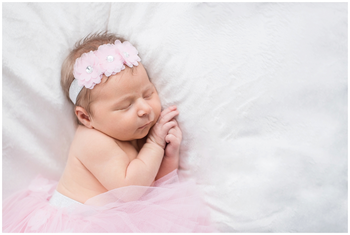 Kingwood photographer - baby girl posed and lifestyle newborn portrait session with white, cream, light peach, light blue tones and a pink tutu