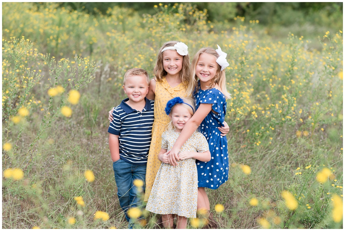 Kingwood family photographer mini session with family of six in natural, outdoor setting