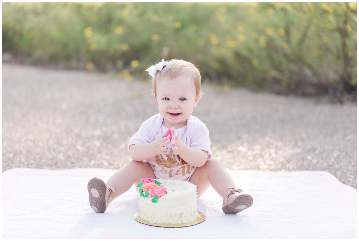 Kingwood photographer mini session with adorable 1 year old in polka dot tutu for cake smash